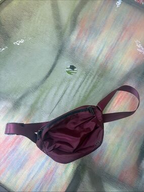 CALIA by Carrie Underwood Burgundy Belt Bag
